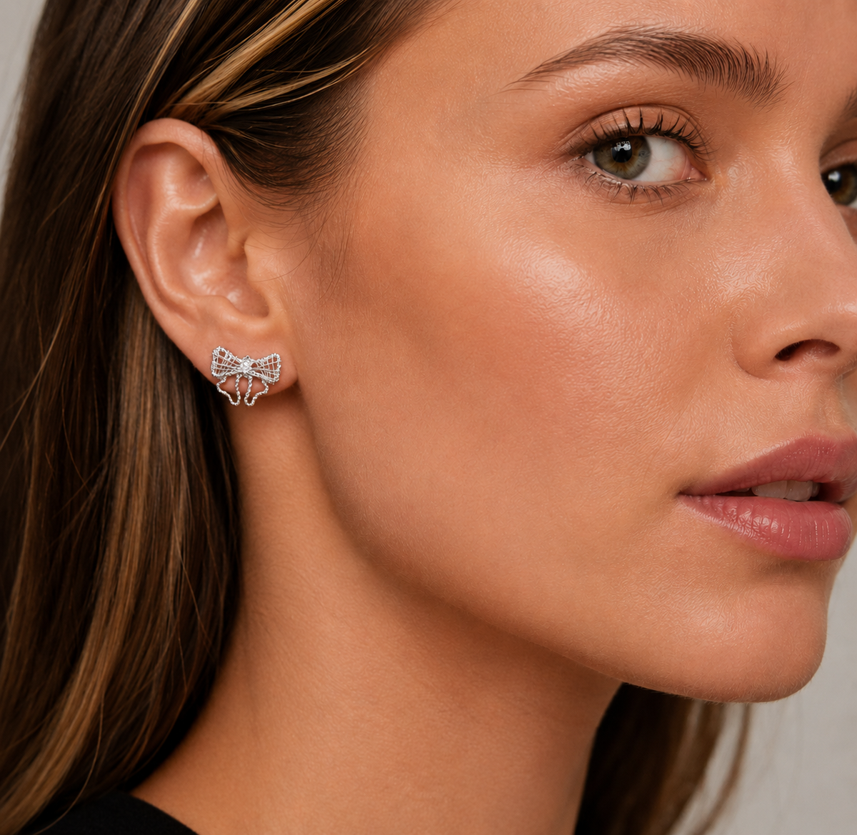 Silver Filigree Ribbon Bow Stud Earrings in 925 sterling silver – angle view
