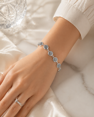 Round Floral Cut-Out Bracelet in 925 sterling silver – angle view